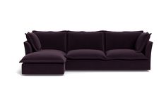 a purple couch sitting on top of a white floor