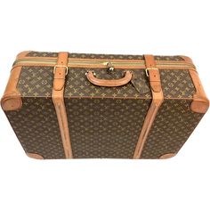 Large Vintage Louis Vuitton leather suitcase. This beautiful piece of luggage features a round top handle and buckle fastenings. Cream colored inside fabric is in good condition and has two side pockets and buckle fastenings. Lock and key included. Zippers in working order. This pre-loved and timeless case can be used for travel or as a magnificent piece of decor. Classic Monogram Canvas Briefcase For Travel, Classic Travel Briefcase In Monogram Canvas, Formal Brown Monogram Canvas Luggage, Classic Formal Monogram Canvas Luggage, Classic Brown Luggage With Leather Trim, Vintage Leather Trim Briefcase For Travel, Vintage Brown Luggage For Trips, Leather Luggage With Leather Trim, Satchel Shape, Vintage Louis Vuitton Luggage