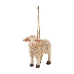 a sheep ornament hanging from a rope