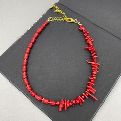 This striking Red Coral choker layering necklace features bold, vibrant beads that add a pop of color to any look. Designed to be worn alone for a statement piece or layered with other necklaces for a dynamic effect, this necklace brings a touch of coastal elegance to both casual and formal attire. Necklace length is 15" long plus additional 4 inch extender chain. - non tarnish gold plated finding - clasp is gold plated stainless steel lobster claw - 4 inches extender is non tarnish gold plated Trendy Red Beaded Necklaces, Trendy Red Choker As Gift, Trendy Red Beaded Necklace With Beaded Chain, Trendy Red Necklace With Colorful Beads, Trendy Red Beaded Chain Necklace, Trendy Red Beads For Gifts, Trendy Red Necklaces With Round Beads, Trendy Red Round Beads Necklace, Trendy Red Necklaces With Colorful Beads