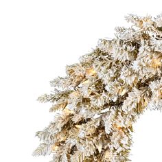 a white christmas tree with lights on it's branches and snow flakes hanging from the top