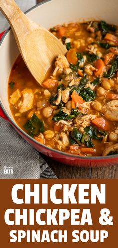 chicken, chickpea and spinach soup in a red pan with a wooden spoon