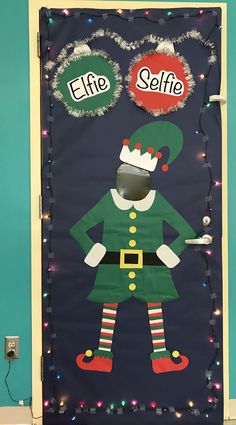 a door decorated to look like elf with the words elf selfie and an elf hat