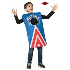 a young boy wearing a blue and red costume