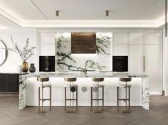 a kitchen with marble counter tops and stools in front of a wall mounted oven