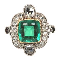 Elegant SSEF certified Art-Déco Colombian Emerald and Diamond Ring, dated circa 1920. Charming Art-Déco ring, set with a cushion-shaped, luminous Colombian emerald of 2.22 ct, minor enhancement, within a surround of 18 rose-cut diamonds in mille-grain settings. This delightful jewel is crafted in platinum and gold and is in very good condition. The emerald is accompanied by SSEF report number 120106, stating that the emerald weighs 2.226 carats, is of Colombian origin, with a minor amount of oil Antique Cabochon Emerald Wedding Ring, Vintage Emerald Rings 1stdibs, Art Deco Green Cabochon Rings, Antique Emerald Ring 1stdibs, Luxury Polished Emerald Ring, Oval Cabochon, Art Deco Diamond Rings, Colombian Emeralds, Art Deco Ring, Emerald Diamond