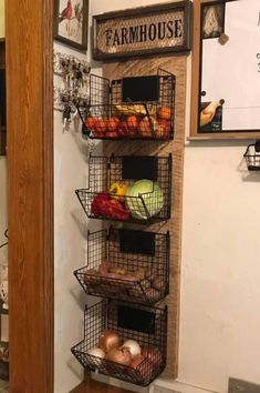 a wall mounted shelf with baskets filled with fruits and vegetables on it's sides