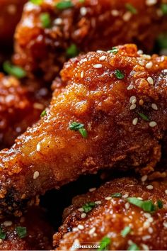 closeup of fried chicken wings with sesame seeds