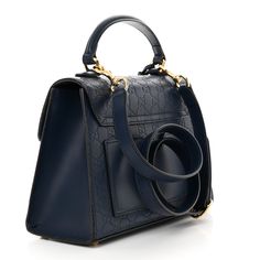 GUCCI Guccissima GUCCI Guccissima Signature Small Padlock Top Handle Bag in Blue Agata. This stylish tote is crafted of Gucci GG monogram embossed calfskin leather in blue. The bag features a leather top handle, an optional shoulder strap and a front flap with a gold push lock closure. The flap opens to a beige microfiber interior with zipper and patch pockets. Gg Monogram, Handle Bag, Blue Bags, Leather Top, Patch Pocket, Top Handle, Calf Skin, Top Handle Bag, Shoulder Strap