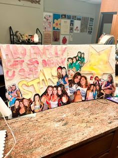 a group of girls standing in front of a sign that says welcome to the stars