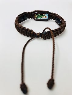 "Hand made Saint Jude bracelet brown double weave Macrame style. Pulsera de San Judas Tadeo hecha a mano de doble tejido estilo Macrame con hilo reforzado en color cafe. San Judas Tadeo el patrono de caso imposible. Adjustable and flexible, for men and women, minimum of 7''inches up to 9'' inches. Pulsera ajustable y expandible para hombre o mujer con minimo cierre de 7\" pulgadas hasta maximo de 9\" pulgadas nudo:12 Material: Brown string #18/Hilo reforzado #18 color cafe Wooden piece (1'' x 1/ Macrame Style, Saint Jude, Double Weave, St Jude, Gold Bead Bracelets, Color Cafe, Gifts For My Boyfriend, Gold Beads, Rope Bracelet