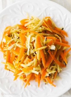 shredded carrots and cabbage on a white plate