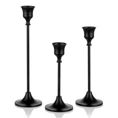 PRICES MAY VARY. SLEEK SURFACE: sophisticated surface treated, this candlestick holder set is very sleek, and in matte black, will be an eye-catching decorative piece on your table or fireplace mantle or shelf FUN & ELEGANT CANDLE HOLDER: exquisite candle holder, stemmed and vintage design, looks elegant and fits various occasions, like daily home interior decoration, parties, Halloween decor, valentines day dinning table decorations EASY TO GO WITH various home interior: vintage look but matte Black Candlesticks On Mantle, Candle Stick Holders Decor, Lit Wedding, Black Candlestick Holders, Tapper Candles, Black Candle Holder, Metal Candle Stand, Black Candlesticks, Black Taper Candles