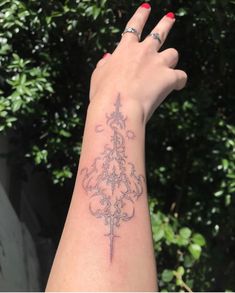 a woman's arm with a tattoo on it