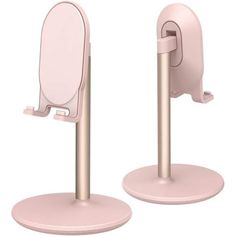 there are two pink toilet stalls on the same pole and one has a mirror in it