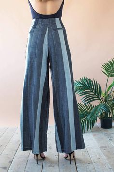 Like it's namesake, the Hepburn Pant is all about updating menswear details with old Hollywood glamour in a leg-elongating silhouette. The wide-legged pants have a high waist, covered buttons at the waistband and a side zip for a sleek fit. The style goes breezy and cool in our gray cotton-blend Graphite Stripe fabric. 69% Cotton, 30% Polyester, 1% Spandex Dry clean Made in the USA Menswear Details, High Waist Wide Leg Pants, Stripe Fabric, Old Hollywood Glamour, Striped Fabrics, Hollywood Glamour, Grey Cotton, Covered Buttons, Old Hollywood