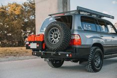 an suv is parked on the side of the road