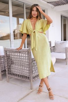 Once you arrive at your destination, enjoy the warm breeze and the Lulus Summer Journey Light Green Tie-Front Cutout Midi Dress! Lightweight, linen-blend woven fabric shapes this breezy dress with a deep V-neckline, a tie-front bodice, and fluttering short sleeves. A fitted waist with side cutouts sweeps down to a midi hem with two side slits. Hidden back zipper/clasp. Fit: This garment fits true to size. Length: Mid-calf length. Size medium measures 44.5" from shoulder to hem. Bust: Great for a Light Green Dress, Cutout Midi Dress, Holiday Dresses Women, Beach Wedding Guests, Tie Front Dress, Breezy Dress, Long Midi Dress