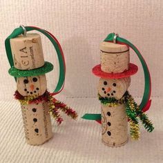 two snowmen made out of wine corks