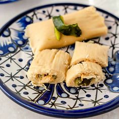 two pieces of food on a blue and white plate