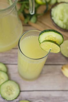 cucumber and lemonade are garnished with slices of lime