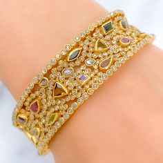 PRODUCT DETAILS Gold Purity(karat): 22k Item Weight(grams): 46.7 Item Finish: Yellow Gold Stone: Polki Diamond Diamond Weight(carats): 10.55ct Accented Stone: Tourmaline Stone Weight: 6.44ct Bangle Size: 2.4 Bangle Opening: 2.25" Openable: Yes, Hinge w/ Screw Gold Multi-stone Diamond Bracelet, Luxury 22k Gold Hand Set Bangle, Luxury Gold Diamond Bracelet With Multi-stone, Luxury Gold Bangle With Rose Cut Diamonds, Gold Diamond Multi-stone Bracelets, Gold Diamond Bracelets With Multi-stones, Gold Bangle With Rose Cut Diamonds, Yellow Gold Multi-stone Bangle For Wedding, Yellow Gold Multi-stone Wedding Bangle