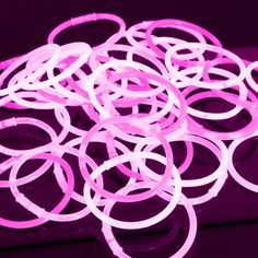 a bunch of pink rubber bands sitting on top of a table