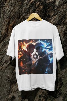 Witness the ultimate clash between Satoru Gojo and Ryomen Sukuna with this striking t-shirt from Jujutsu Kaisen. Featuring an intense fan art design, this tee is perfect for anime fans who love epic showdowns. Crafted with 100% ethically sourced US cotton, it offers unbeatable comfort and durability. Whether you're at an anime convention or out with friends, this premium tee is a must-have for your wardrobe.     Epic Showdown Design: Stunning fan art of Gojo vs. Sukuna from Jujutsu Kaisen 🔥⚡     Material: 100% cotton for a soft, breathable feel 🌱     Fit: Classic fit with a crew neckline for a timeless, relaxed look     Durability: Ribbed knit collar ensures shape retention, and the tear-away label provides irritation-free wear 🚫     Seamless Sides: No side seams for a smooth, clean fit White Character Print Tops For Fan Events, White T-shirt With Sublimation Print For Cosplay, White Sublimation Print T-shirt For Cosplay, White Anime Style T-shirt With Sublimation Print, White Anime Style Top With Sublimation Print, White Anime Top With Sublimation Print, White Tops With Sublimation Print For Cosplay, White Sublimation Print Top For Cosplay, Anime Style White T-shirt For Cosplay