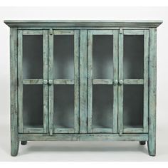 an old wooden cabinet with glass doors on the front and bottom shelves, against a white background