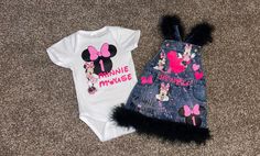 a minnie mouse outfit and denim skirt are laying on the floor