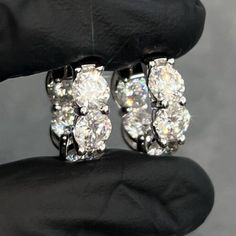 Stunning oversized 8 carat hoops made with 6mm (0.80 carat) prong set stones. Moissanite offers timeless beauty and exceptional value. This is the best compromise between cheap fakes (CZ, crystal, rhinestone) and extremely expensive diamond studs. Natural diamond equivalent hoops cost $8000+. Get the same look at a reasonable price. Order yours today! -VVS1 Clarity D color GRA certified Moissanite Stones -Hearts and Arrows Pattern Ideal Cut, Excellent Rating.  -More Fire and Brilliance than Cheap Priced Moissanite online -9.5 Hardness Rating (will not dull/scratch easily). Diamonds are perfect 10, most fake stones are 3-4.  -Choose Sterling Silver (Rhodium or Gold Plated) -Passes many Thermal Diamond Testers -Comes with inner/outer box with GRA certificate Luxury Round Diamond Earrings Vvs Clarity, Luxury Diamond Earrings With Vvs Clarity For Anniversary, Luxury Round Diamond Earrings For Anniversary, Luxury Vvs Clarity Diamond Earrings For Anniversary, Luxury Round Moissanite Earrings, Luxury Round Cut Hoop Earrings For Formal Occasions, Luxury Formal Round Cut Hoop Earrings, Classic Aaa Quality Cubic Zirconia Diamond Earrings, Luxury Oval Hoop Earrings Aaa Quality