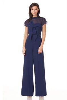 Elegant yet comfortable, our jumpsuit is crafted with stretch knit crepe—showcasing a beautiful drape. Framed by an illusion neckline, it features a stunning oversize bow detail. Final touches include a back zipper and a wide leg silhouette at the hem. Bridesmaids Jumpsuits, Jumpsuit Style, Jumpsuit Navy Blue, Coverall Jumpsuit, Formal Jumpsuit, Tie Waist Jumpsuit, Crepe Jumpsuit, Jumpsuit Dressy