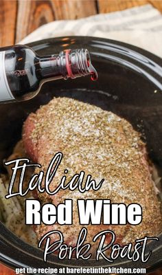 a bottle of red wine being poured into a slow cooker with pork roast in it