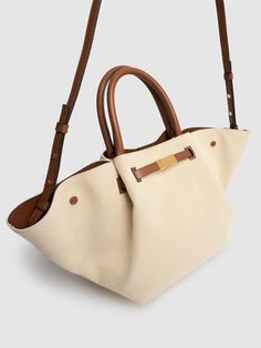 Find DEMELLIER Midi New York Canvas Tote Bag on Editorialist. Height: 22cm Width: 50cm Depth: 15cm. Minimum strap drop: 47cm. Maximum strap drop: 53cm. Top handle drop: 12cm. Adjustable strap. Double top handles. Logo detail. Cotton lining Neutral Top Handle Bag With Detachable Handle, Beige Handheld Satchel With Leather Handles, Leather Shoulder Bag With Handles In Neutral Color, Neutral Leather Shoulder Bag With Handles, Modern Beige Satchel With Leather Handles, Neutral Top Handle Shoulder Bag With Detachable Handle, Neutral Double Handle Shoulder Bag With Leather Handles, Neutral Top Handle Shoulder Bag With Detachable Strap, Neutral Shoulder Bag With Double Carry Handles