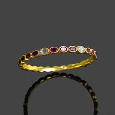 Bangle Size:  All Size Available Stone Size  :  5 X 9 mm Weight: 18 gm Color: Multi Color Material: Brass Natural Ruby & Polki Bracelet \ Gemstone Bangle \ Minimal Bracelet \ Dainty Bangle \ Vintage Bangle \ Multi Stone Bangle \ Gifts For Mother . Contact us for wholesale prices. R I N G S https://www.etsy.com/in-en/shop/GemFormingStudio?section_id=22783374 B E A D S https://www.etsy.com/in-en/shop/GemFormingStudio?section_id=22828835 W A N D S https://www.etsy.com/in-en/shop/GemFormingStudio?se Luxury Ruby Gemstone Bangle, Round Crystal Bracelet With Stones, Adjustable Jeweled Crystal Bangle Bracelet, Adjustable Crystal Bangle Bracelet With Jewels, Elegant Adjustable Jeweled Bangle, Dainty Stackable Round Bangle, Dainty Gemstone Bangle Bracelet, Adjustable Round Bracelets With Bezel Setting, Red Bangle Jewelry With Jewels