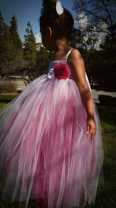 This fancy dress is made with layered magenta pink tulle underneath a layer of white tulle. A beautiful magenta pink colored flower with center embellishments adorns the top as well as a stylish white flower with center rhinestones. Adjustable straps tie in a bow at the back of the dress for a stunning look. You are welcome to customize this dress, please message us with questions. Many colors are available, message us with colors you prefer, we love to customize! Standard sizing chart is used, Sweet Pictures, Morgan Hill, Dress Fancy, Lovely Eyes, Handmade Kids, White Tulle, Baby Dresses, Magenta Pink, Pink Tulle