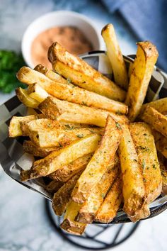 french fry seasoned fries in a basket with dipping sauce on the side and text overlay that reads easy homemade french fry seasoning