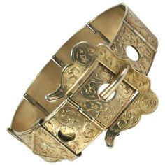 Victorian Etched Buckle Bracelet of gilt metal. Elaborate etched detailing throughout. 1880's USA. Fits smaller size to 6.25" wrist. Excellent condition. 1.25" wide at buckle. Victorian Drop Earrings, Hand Brooch, Buckle Jewelry, Festoon Necklace, Ivory Earrings, Coral Bracelet, Buckle Bracelet, Strand Bracelet, Sea Glass Jewelry