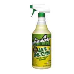 a bottle of green antibacterial cleaner on a white background