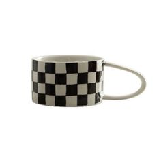 a black and white checkerboard coffee mug on a white background with the handle extended