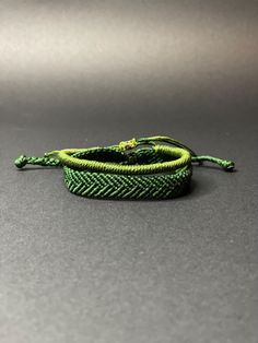 Highlights : 💡 Material : %100 PAK - Polyester/Polyamide Closure : Tie Adjustable Style : Herringbone, Elegant, Modern Size : 6,6 inch (16-17 cm) Bright, Vivid Colours ✨ Product Description : ✨ 🎩 MY distinguished collection of Herringbone Bracelets, where timeless elegance meets modern masculinity. 🎩 The meticulously crafted bracelets are designed to add a touch of sophistication to your everyday style, making a statement that effortlessly blends classic charm with contemporary flair. 🎩 The sleek herringbone design of our bracelets is complemented by high-quality materials, ensuring durability and a refined finish. Whether you're dressing up for a special event or elevating your daily attire, this bracelet is the perfect companion for the modern man who appreciates the fusion of tradit Green Woven Friendship Bracelets, Trendy Handmade Green Braided Bracelets, Trendy Handmade Green Braided Bracelet, Casual Green Braided Bracelet Gift, Adjustable Green Woven Jewelry, Casual Handmade Green Braided Bracelets, Casual Green Handmade Braided Bracelet, Adjustable Green Woven Braided Bracelets, Green Woven Braided Bracelet As Gift