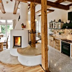 a kitchen with an oven, stove and dining room table