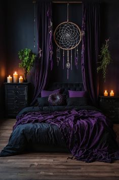 a black and purple bedroom with candles