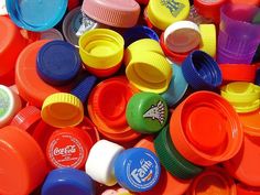 many different colored plastic cups and lids