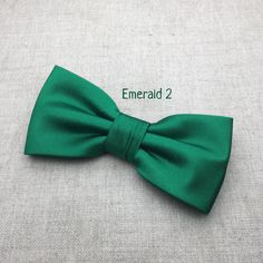 "We proudly present our premium handmade pre-tied bow tie for Adult/Men/Women/Kids/Children/Toddler/Baby boy/girl.... **The bow tie is pre tied and hand stitched into place.** Material: Satin Choose your Bow tie ATTACHMENT/STRAP: - CLIP-ON (strapless) - Adjustable VELCRO strap - Adjustable strap with METAL HOOK, EYE ADJUSTER HARDWARE SIZES are shown below: - NEWBORN-1YR : Adjustable straps fit 7\" up to 11\" neck circumference. - TODDLER (1-3YR) : Adjustable straps fit 10\"-12\" neck circumferen Classic Green Bow Tie For Gifts, Green Bow Tie For Gifts, Green Bow Tie Ideal As Gift, Green Bow Tie Gift, Green Bow With Bow Tie Back For Gift, Classic Green Bow Tie For Formal Occasions, Green Satin Bow For Gifts, Green Dapper Bow Tie For Groom, Dapper Green Bow Tie For Groom