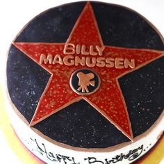 a close up of a birthday cake with a star on it