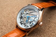 DESCRIPTION:  This is a fine classic mechanical watch. It does not require battery. All the parts on this watch is beautifully crafted. Cool thing about this watch is that you can actually see through front to back, to sides and you can enjoy all the gears move inside the watch.  COLOR: ROSE GOLD WITH ORANGE LEATHER STRAP WITH DEPLOYANT BUCKLE (20mm Band) WATCH CASE SIZE: 41MM WATCH THICKNESS: 13MM DISPLAY: ANALOG CASE: STAINLESS STEEL GLASS: MINERAL MOVEMENT: AUTOMATIC WATER RESISTANCE RATING: Rose Gold Leather Watch With Skeleton Dial, Rose Gold Leather Watch Accessories With Skeleton Dial, Rose Gold Watches With Skeleton Dial As Gift, Rose Gold Watch With Skeleton Dial As Gift, Leather Skeleton Dial Watch Accessories As Gift, Rose Gold Watch Accessories With Skeleton Dial As Gift, Leather Watch With Skeleton Dial As Gift, Leather Watch Accessories With Skeleton Dial As Gift, Timeless Rose Gold Watch Accessories With Skeleton Dial