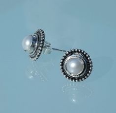 VINTAGE CHIC. These gorgeous vintage inspired MABE pearl stud earrings are really special. They are set in an intricate design of 925 silver. The pearl size diameter is .5 cm. The total earring diameter is 1.3 cm. What an amazing gift for that special friend who appreciates unique style. Also they come with a lovely felt gift bag.  FREE SHIPPING TO ABSOLUTELY ANYWHERE. Thanks for visiting ARTMANIA SILVER POLISHING CLOTH: Even the best silver gets tarnished over time, keep your silver treasures looking fabulous with this AMAZING SILVER POLISHING CLOTH. A few rubs and its as good as new.  Also works for gold. ONLY $US 8 Victorian Round Pearl Earrings As Gift, Victorian Style Pearl Earrings As Gift, Vintage Silver Round Pearl Earrings, Felt Gifts, Mabe Pearl, Pearl Stud Earrings, Special Friend, Pearl Size, Pearl Studs