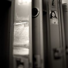 three toothbrushes with pictures on them sitting next to each other in black and white