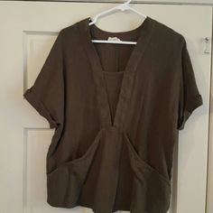 Nwot. Loose Fitting Kangaroo Pocket Short Sleeved Top. Olive Green In Color Vacation Tops With Pockets And V-neck, Vacation V-neck Blouse With Pockets, Brown Tops With Pockets For Day Out, Brown Top With Pockets For Day Out, Pocket Top, Shorts With Pockets, Kangaroo Pocket, Kangaroo, Olive Green